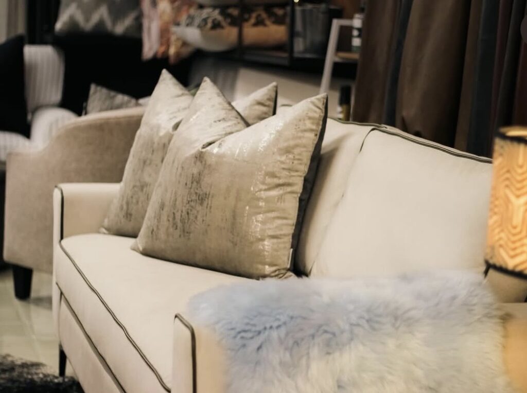 Cream linen sofa styled with textured pillows