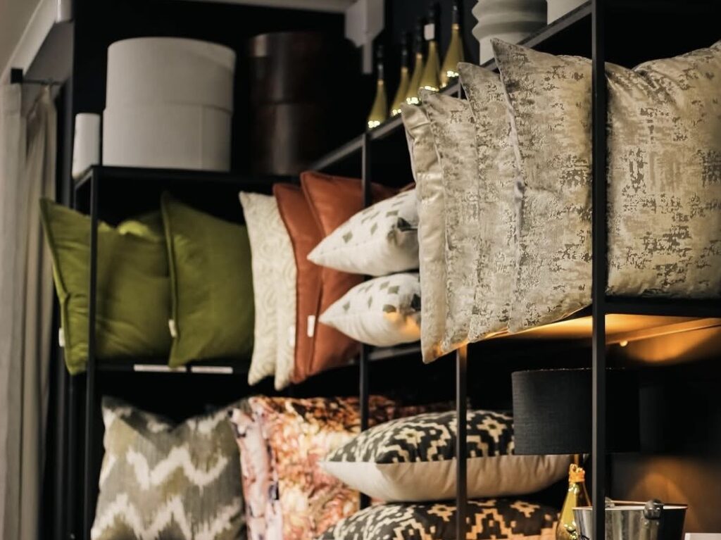 Decorative pillows arranged with a fabric swatch display